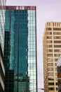 Sky reflecting off the windows in a city high-rise tower