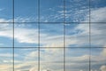 Sky reflection in modern skyscraper window. Cloudscape view reflected in futuristic architectural structure. Abstract view, space