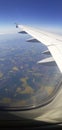 View of the ground and the sky from a airplane .