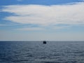 Fishing boat on the horizon of the sea