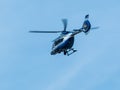 Blue helocopter in blue sky