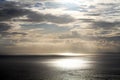 Sky after the storm. Natural background of sunset light over the ocean. Summer sky over horizon with calm wave water. Royalty Free Stock Photo