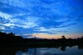 Sky in sunset cloud colorful beautiful with silhouette tree woodland and river reflect in countryside evening on nature Royalty Free Stock Photo