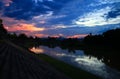 Sky in sunset cloud colorful beautiful with silhouette tree woodland and river reflect in countryside evening on nature Royalty Free Stock Photo