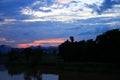 Sky in sunset cloud colorful beautiful with silhouette tree woodland and river reflect in countryside evening on nature Royalty Free Stock Photo