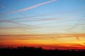 sky at sunset, the clouds are colored red by the sun that in a while will make room for the moon