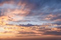 Orange and blue sunset sky with clouds glowing, perfect for background replacements