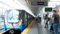 Sky Train train canceled all trains car breakdown people waiting on the platform red lights glowing in the window on the