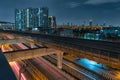 Sky train railway in metropolis in night life. Transportation concept
