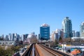 sky train road from Surrey to Vancouver passing trains skyscrapers office buildings science center and other stations