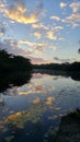 Reflection in River at Sunset Rio Nuevo, Orange Walk, Belize Royalty Free Stock Photo