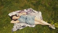 Sky view cheerful young woman on green grass. Beautiful girl relaxing on grass Royalty Free Stock Photo