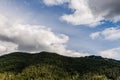 Sky with white clouds above small mountains in british columbia Canada