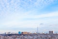 Sky with white clouds over houses and TV tower Royalty Free Stock Photo