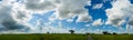 Sky with white fluffy clouds on the blue sky over the rice field