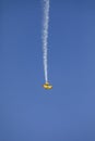Skyaces plane performing Aerobatics with a smoke trail Royalty Free Stock Photo
