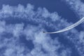 Skyaces plane performing Aerobatics with a smoke trail Royalty Free Stock Photo