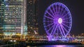 Skycrapers night timelapse and Hong Kong Observation Wheel, which is the latest tourist attraction in the city. Royalty Free Stock Photo