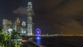 Skycrapers night timelapse and Hong Kong Observation Wheel, which is the latest tourist attraction in the city. Royalty Free Stock Photo