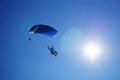 Skydiver with a blue parachute close up under sunshine Royalty Free Stock Photo
