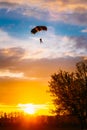 Skydiver On Colorful Parachute In Sunny Sky Royalty Free Stock Photo