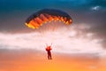 Skydiver On Colorful Parachute In Sunny Sky Royalty Free Stock Photo