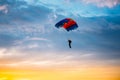 Skydiver On Colorful Parachute In Sunny Sky Royalty Free Stock Photo