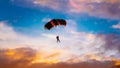 Skydiver On Colorful Parachute In Sunny Sunset Royalty Free Stock Photo