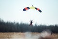 Skydivers jump out of a plane at low altitude