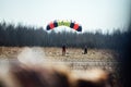 Skydivers jump out of a plane at low altitude
