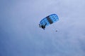 Skydiver flies under the canopy of a parachute, bottom view, close-up