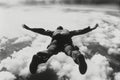 Skydiver in Free Fall Over Clouds at High Altitude Royalty Free Stock Photo