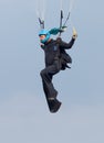 Skydiver hanging from parachute focusing and aiming for perfect