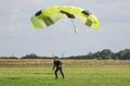 A skydiver landing after performing skydiving with parachute Royalty Free Stock Photo