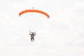 Skydiver with a little canopy of a parachute on the background a blue sky, close-up. Skydiver under parachute Royalty Free Stock Photo