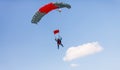 Skydiver with a little canopy of a parachute on the background a blue sky, close-up. Skydiver under parachute Royalty Free Stock Photo