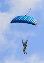 A skydiver performing skydiving with parachute Royalty Free Stock Photo