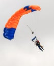 A skydiver performing skydiving with parachute Royalty Free Stock Photo