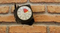 Skydiving altimeter, used by skydiver, with a pen for annotation, brick background, top view, zoom photo