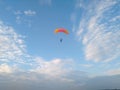 A skydiver with a sports parachute wing flies before landing in the summer Royalty Free Stock Photo