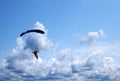 Skydiver under a dark blue little canopy of a parachute on the b Royalty Free Stock Photo