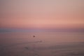 Skydiver under parachute above the stormy clouds. Silhouette man under control parachute to the beach at sunset time. Wallpaper Royalty Free Stock Photo