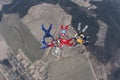 Six skydivers in the winter sky. Royalty Free Stock Photo