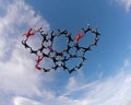 Skydivers holding hands low angle view