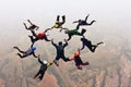 Skydivers holding hands making a fomation. High angle view.