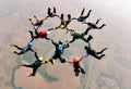 Skydivers holding hands making a fomation. High angle view.