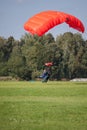 Skydivers parachutist on blue sky on sunset