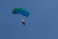 Skydivers parachutist on blue sky on sunset