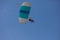 Skydivers parachutist on blue sky on sunset