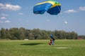 Skydivers parachutist on blue sky on sunset